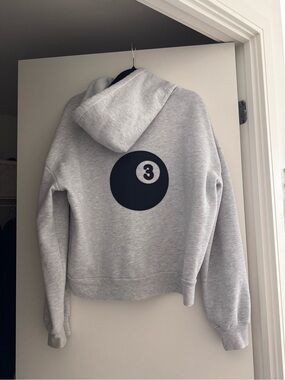 Subdued Gray Hooded Sweatshirt with Black 3-Ball Graphic